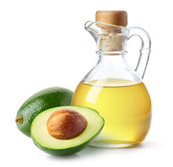 Bottle of avocado oil and fresh avocado halves on white background