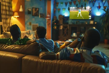 Foto op Canvas Guys of different nationalities watch soccer on the couch at home and cheer for their team © VetalStock