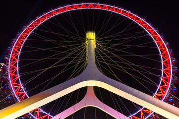 Illuminated Tianjin Eye giant ferris wheel by night, China