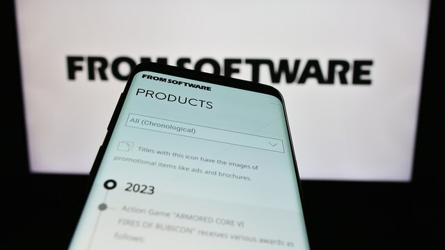 Stuttgart, Germany - 02-19-2024: Mobile phone with website of Japanese video games company FromSoftware Inc. in front of business logo. Focus on top-left of phone display.