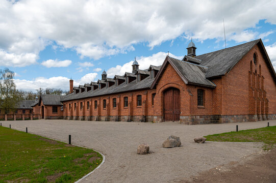 Zagare manor red brick stables on a sunny spring day, Lithuania