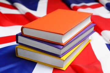 Learning foreign language. Different books on flag of United Kingdom
