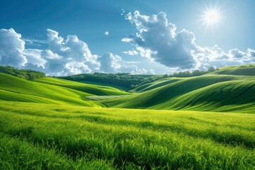 Fototapeta premium Breathtaking landscape of vibrant green hills under a clear sky with the sun radiating warmth and light