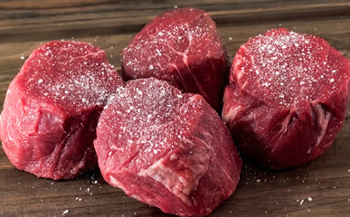 Beef steak raw meat close up on wooden board. Cooking beef steak slice for restaurant, menu, advert for package, selective focus - obrazy, fototapety, plakaty