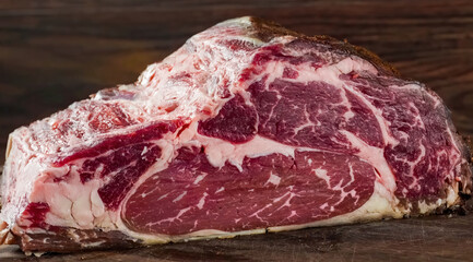 Beef steak raw meat close up on wooden board. Cooking beef steak slice for restaurant, menu, advert...