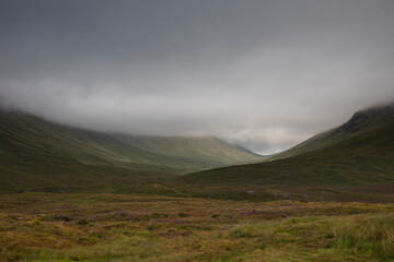 View of the Glencoe mountains on a day with dramatic skies from Glencoe viewpoint