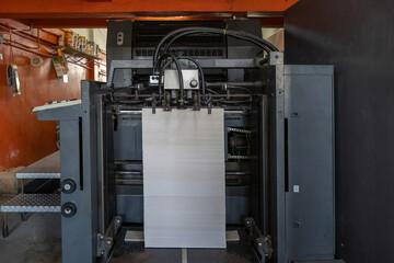 Printed sheets of paper are served in the printing press. Offset , CMYK. Offset printing machines....