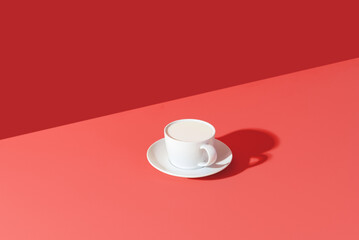 Cup of milk minimalist on a pink table