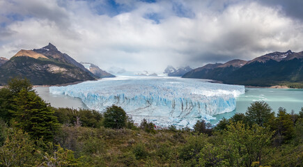 Majestic Glacier Surrounded by Mountains and Forest