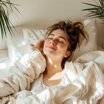 Generative AI image of woman waking up, looking down right in minimalist and cozy bedroom. She is happy and has messy hairs. The bedroom is white and has one plant.