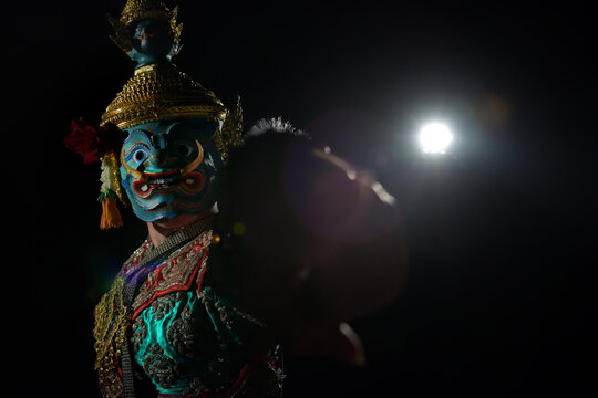 Thai classical masked play(or masked ballet) performed by traditional Thai style dancers waring the costume and mask in the story of Ramayana.This pic performed as Ravana or "Todsakan" in Thai. 