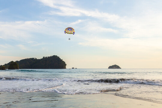 Two men floating from a parasail wing in the sky, Manuel Antonio, Puntarenas province, Costa Rica