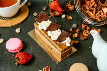Cake on Table Next to Tea Cup