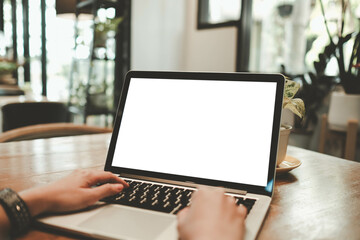 Close-up image of a woman sitting in the cafe and using her laptop. A laptop  white blank screen mockup for display your graphic banner.