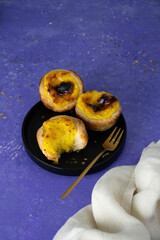 Pastel de nata or Portuguese egg tart. Small tart with a crispy puff pastry crust and a custardy pastry cream filling