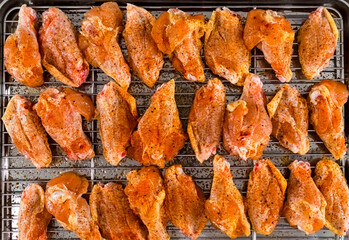 Chicken wings barbecue roasted cooking with spices. Fried chicken wings, homemade, food for restaurant, menu, advert or package, close up. American cuisine. - 746597284