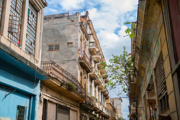 Fototapeta na wymiar Historic buildings on Calle Muralla Street between Aguacate and Compostela Street in Old Havana (La Habana Vieja), Cuba. Old Havana is a World Heritage Site. 