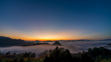 Fototapeta na wymiar View of mountains with sea of mist in morning at Jabo village, Mae Hong Son, Thailand