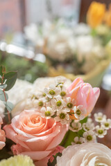 small white flowers in a composition or bouquet. Chamelaucium in a bouquet close-up