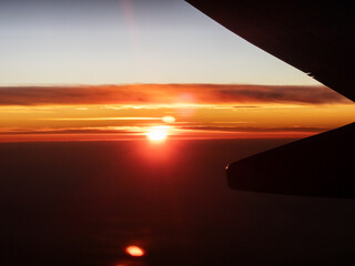 Majestic Sunset View from Airplane Wing at High Altitude