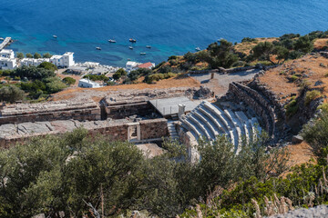 milos geek island ancient theatre view from the top together with tiny village Klima at seaside