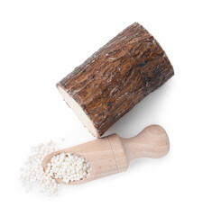 Scoop with tapioca pearls and cassava root isolated on white, top view