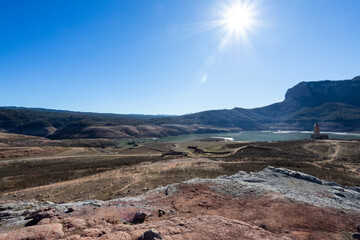 Lack water Sau Reservoir. The swamp is at very low water levels due to lack of rain. Desertification, climate change, environmental problems, drought. Barcelona, Spain