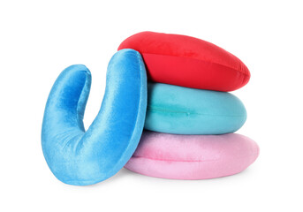 Many soft travel pillows isolated on white