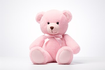 a pink teddy bear with a bow