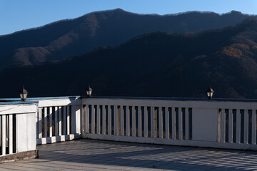 View of the wooden floor and fence in the autumn mountain