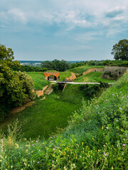 Park with green hills and historical architecture at the Petrovaradin Fortress