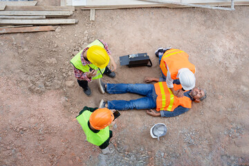 senior man construction worker having heart attack at construction site,safety team and engineers...