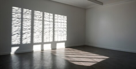 Fototapeta premium empty white wall of the room with a shadow from the window 