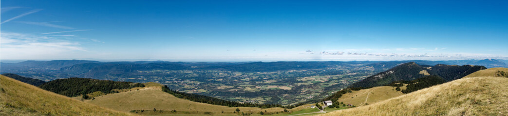Panorama from Grand Colombier summit (France) on a clear summer day, looking westward showing the Valromey plateau and valley