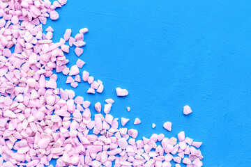 Decoration with stones frame on blue background top view copyspace