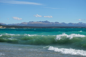 Waves in the lake with a view of mountain