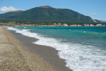 Waves in the lake with a view of mountain