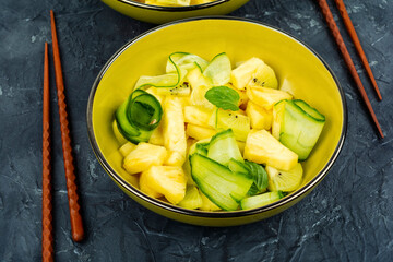 Healthy ananas and cucumber salad.