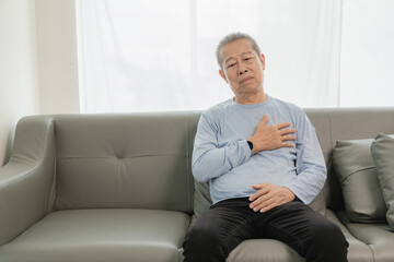 An old Asian man with chest pain was suffering from a heart attack, having difficulty breathing and...