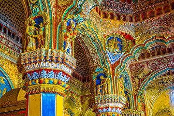 Thanjavur, Tamil Nadu, India - The high arches artworks and colorfully painted wall murals and...