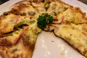 A close-up photo of Italian meat lover pizza at Belle Vue Roof Restaurant at GH Universal Hotel, Bandung, Indonesia
