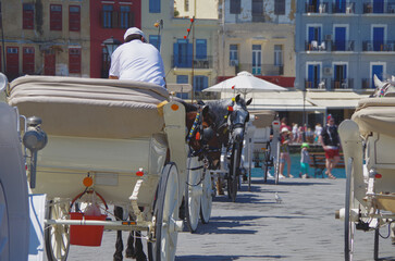 Picturesque cityscape skyline view of Chania, Crete with yacht marina, sailing boats, historic...