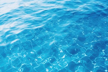 A serene image of a blue pool with clear water and gentle ripples. Perfect for summer and relaxation concepts