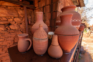 The process of making pots by passing specially extracted red colored soil through various stages.
