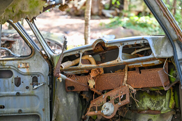 Interieur of Old cars in wild nature on the Kyrko Mosse Car Cemetery, former junkyard, in the forest, Kyrkö Mosse, Ryd, Smaland, Sweden