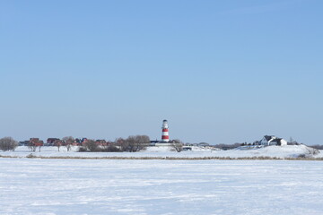 A Norwegian-style hotel complex with a lighthouse on the shores of the lakes. Fishing village