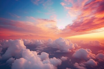 A beautiful sunset scene with the sun setting over the clouds. Perfect for travel and nature concepts