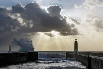Lighthouse at moody sunset