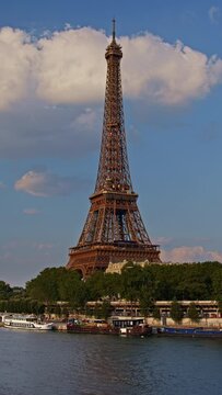 Vertical footage for story and reel of Eiffel Tower. The famous Paris eiffel tower in France. Time lapse of the tower Paris, France. Tourists enjoy historical landmark and symbol of Paris