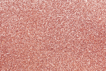 Rose gold color glitter paper texture as background